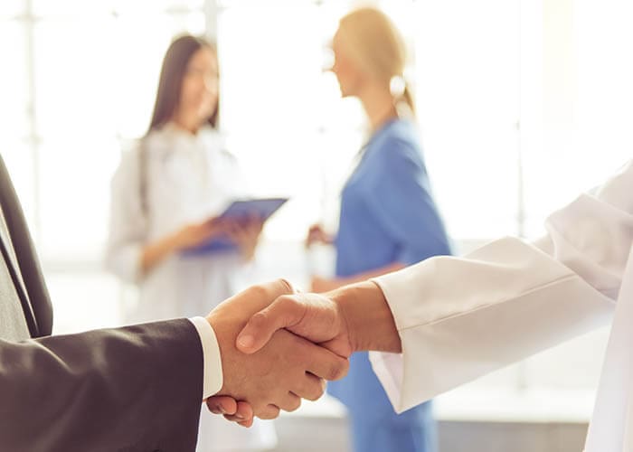 Dentist shaking hands