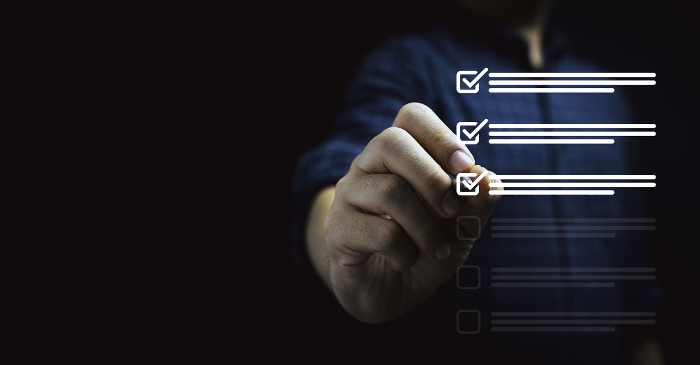 Businessman using pen to tick mark for check review and approve virtual document , Quality assurance and ISO concept